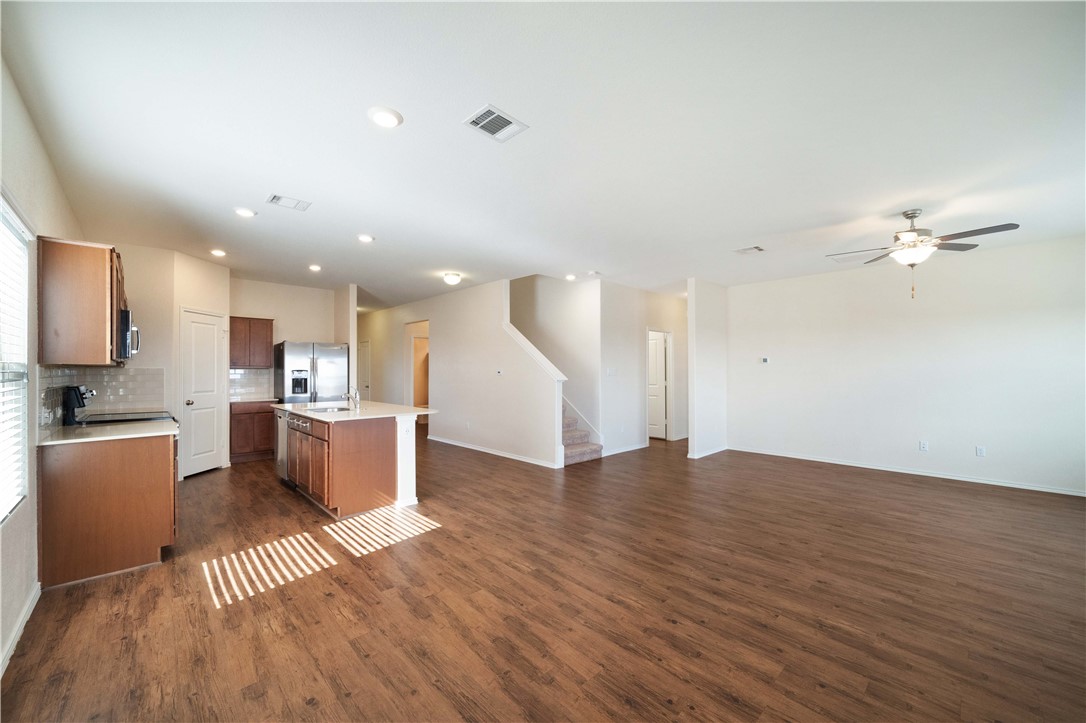 820 Kates Way Hutto, TX 78634 - Photo 9 of 30 a view of kitchen with cabinets and wooden floor