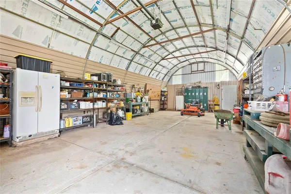 a view of parking garage with cars