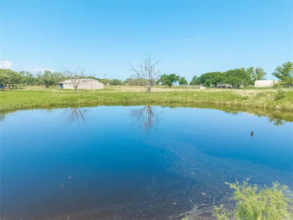 a view of a lake with a big yard