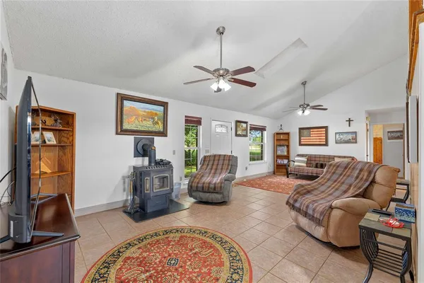 a living room with furniture a wooden floor and a window