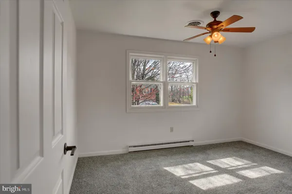 a view of a chandelier fan in a room