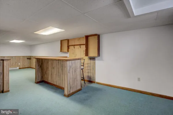 a view of a room with wooden walls