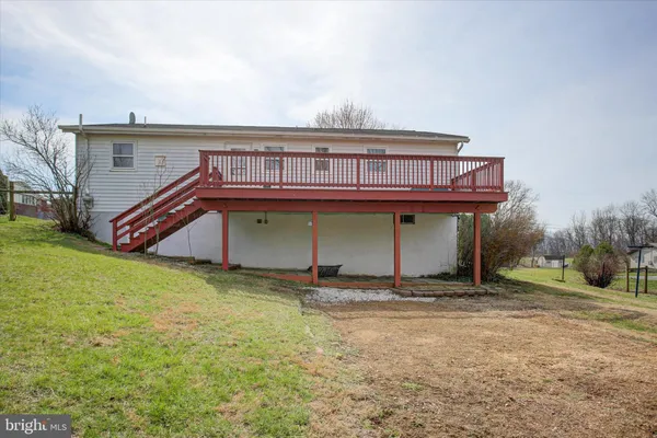 a balcony with wooden floor and fence