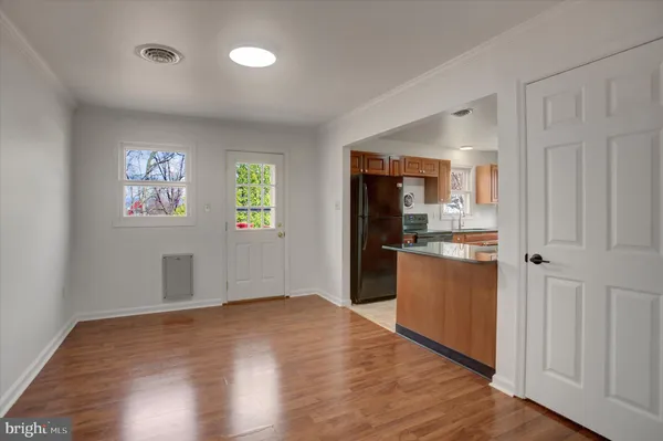 a kitchen with stainless steel appliances a refrigerator and a stove top oven