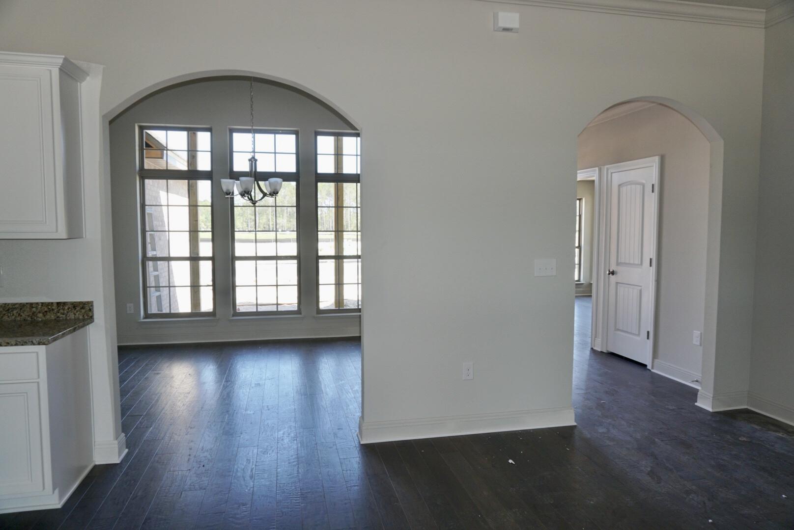 73 Wayne Trail Santa Rosa Beach, FL 32459 - Photo 5 of 13 an empty room with wooden floor and a window