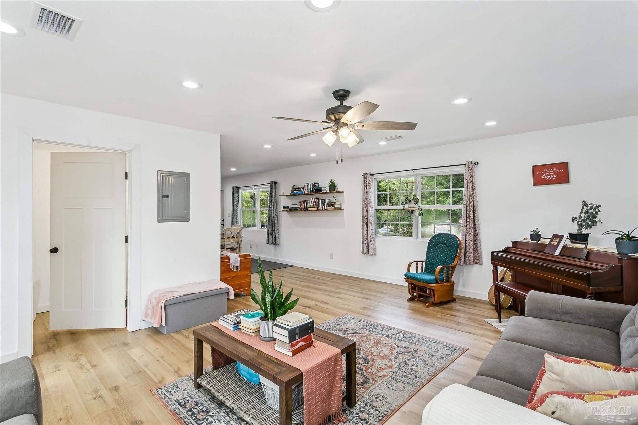 1095 River Annex Road Cantonment, FL 32533 - Photo 12 of 32 a living room with furniture and a large window