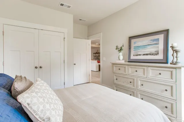 a bedroom with a bed and a cabinets