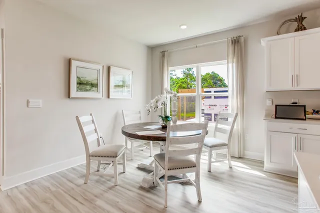 a view of a dining room with furniture window and outside view
