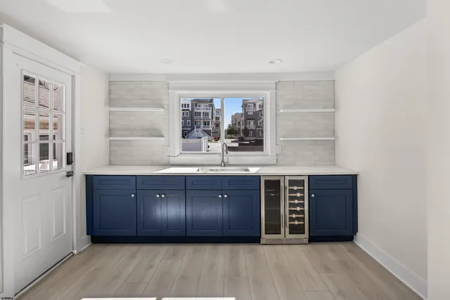 a large room with a large window and double vanity