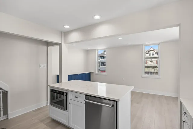 a kitchen with a stove and a refrigerator