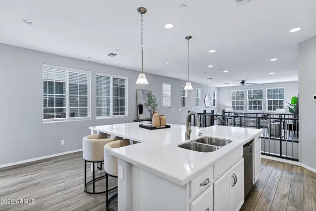 a kitchen with counter space sink appliances and cabinets