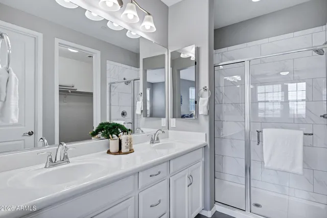 a bathroom with a double vanity sink mirror and double