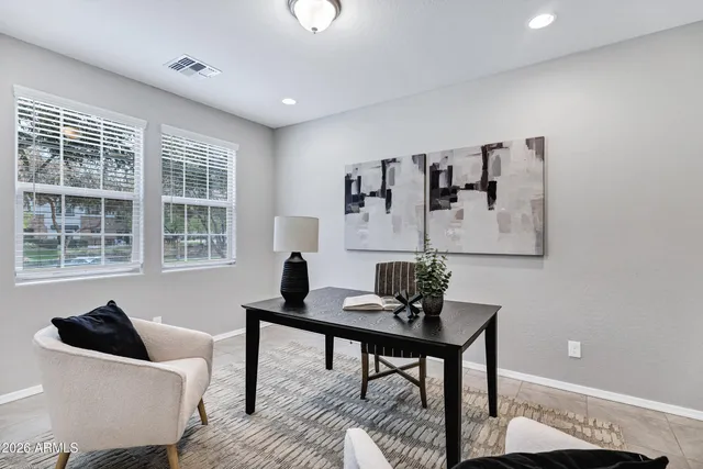 a living room with furniture and windows