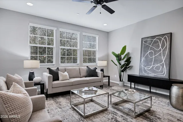 a living room with furniture and a large window