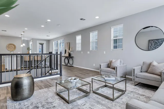 a living room with furniture and a glass door