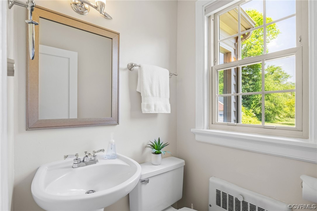 3917 Brook Road Richmond, VA 23227 - Photo 20 of 41 a bathroom with a sink a toilet and a window