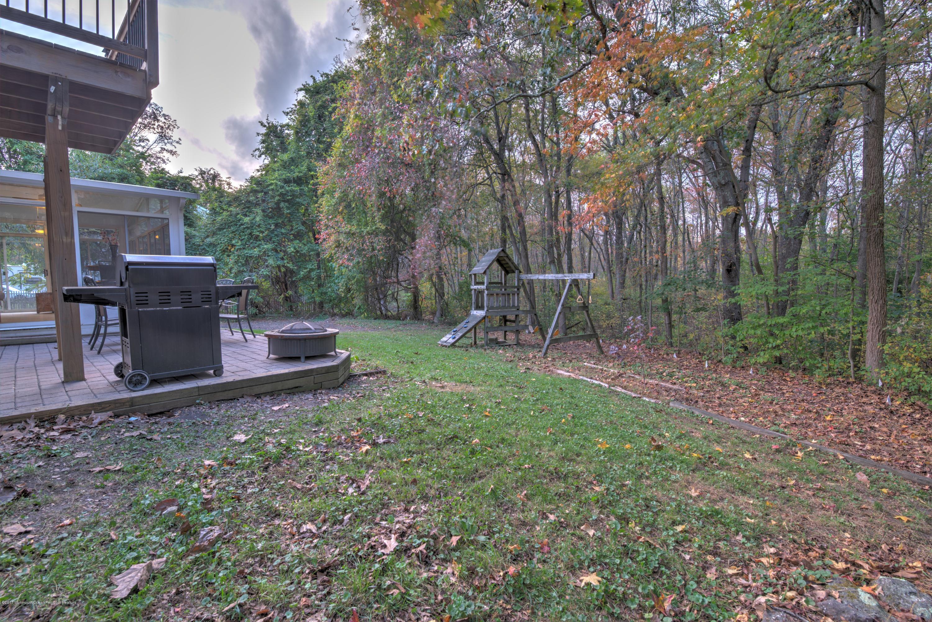 15 Reiner Road Cream Ridge, NJ 08514 - Photo 25 of 27 a backyard of a house with table and chairs
