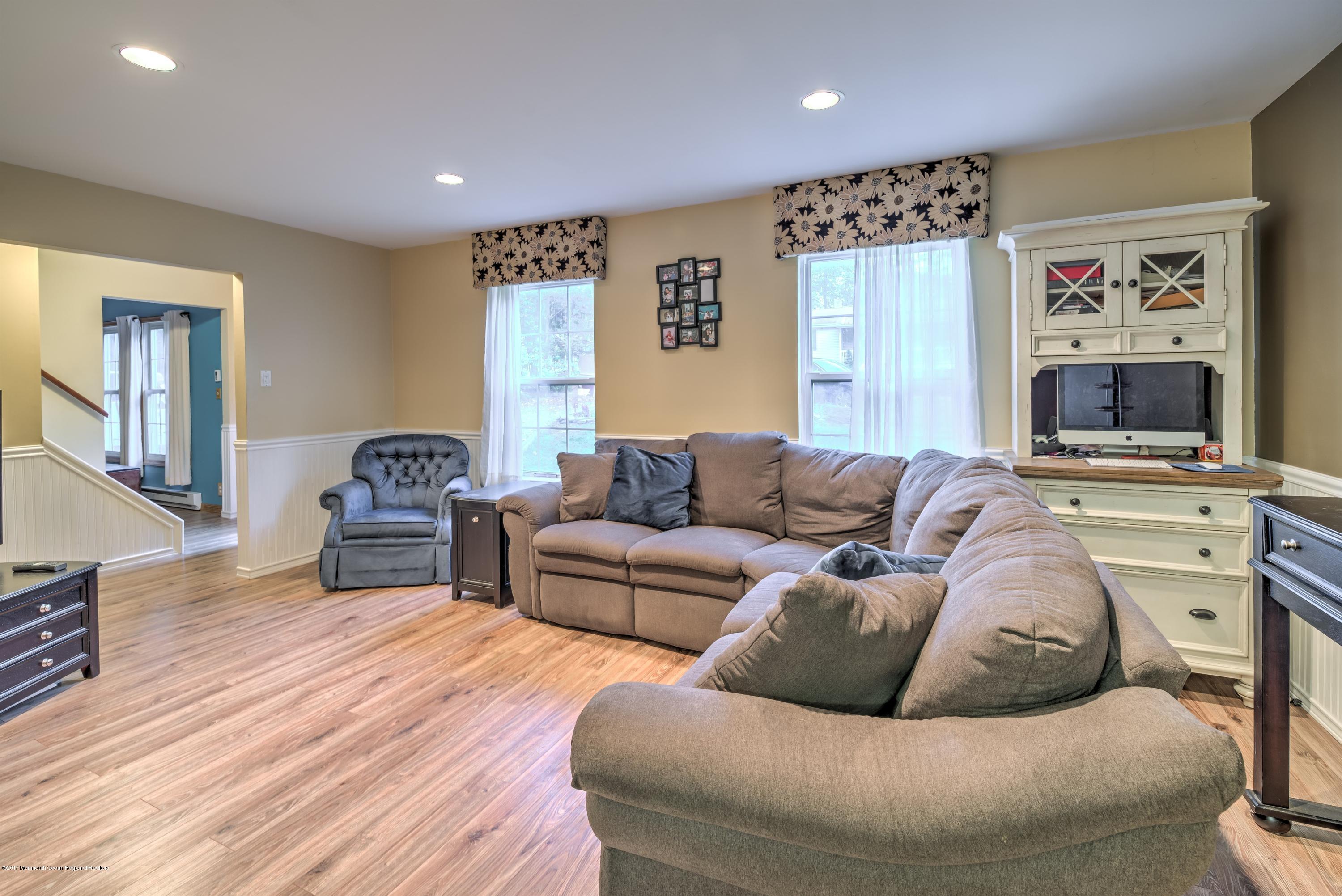 15 Reiner Road Cream Ridge, NJ 08514 - Photo 4 of 27 a living room with furniture and a flat screen tv