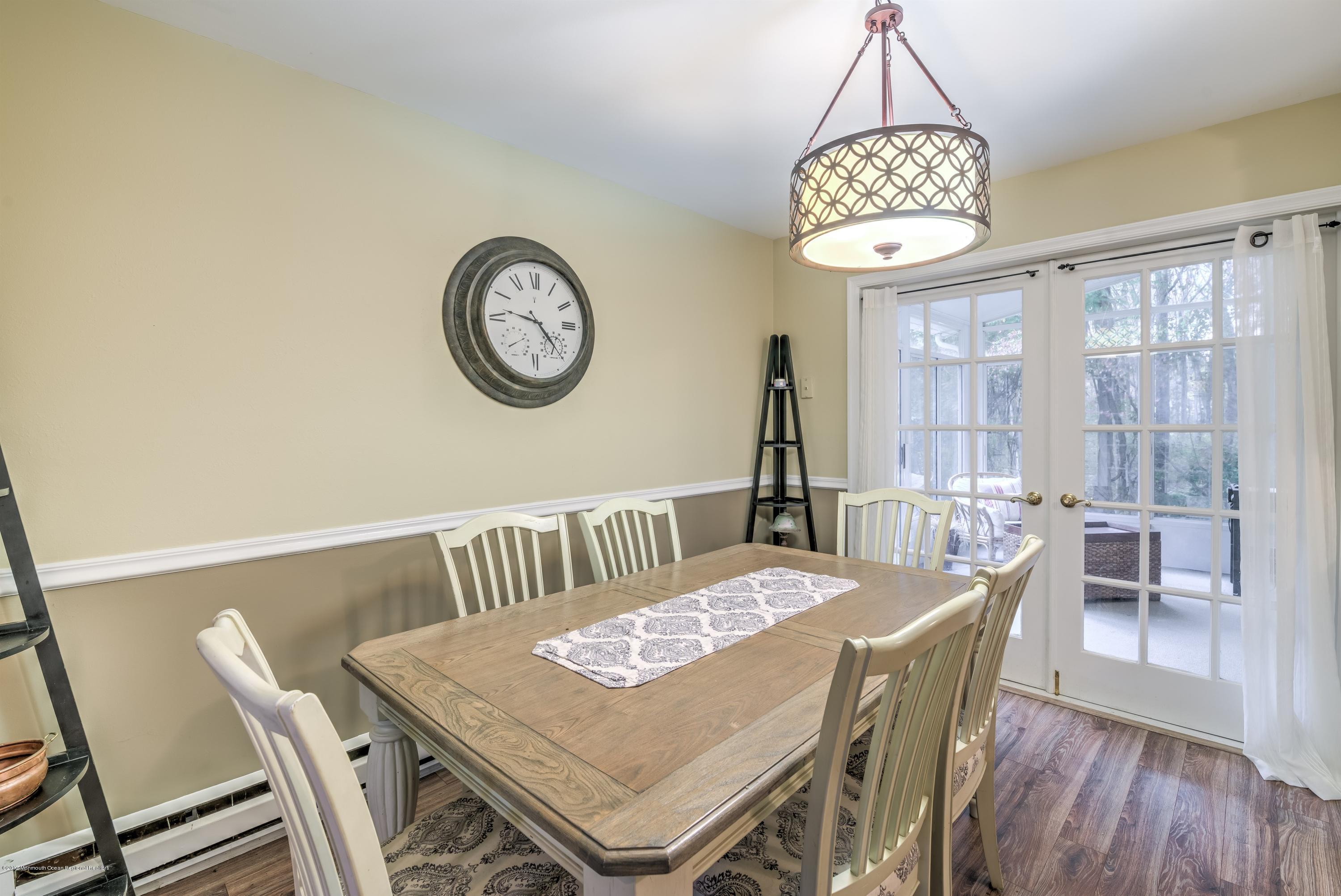 15 Reiner Road Cream Ridge, NJ 08514 - Photo 9 of 27 a view of a dining room with furniture window and wooden floor