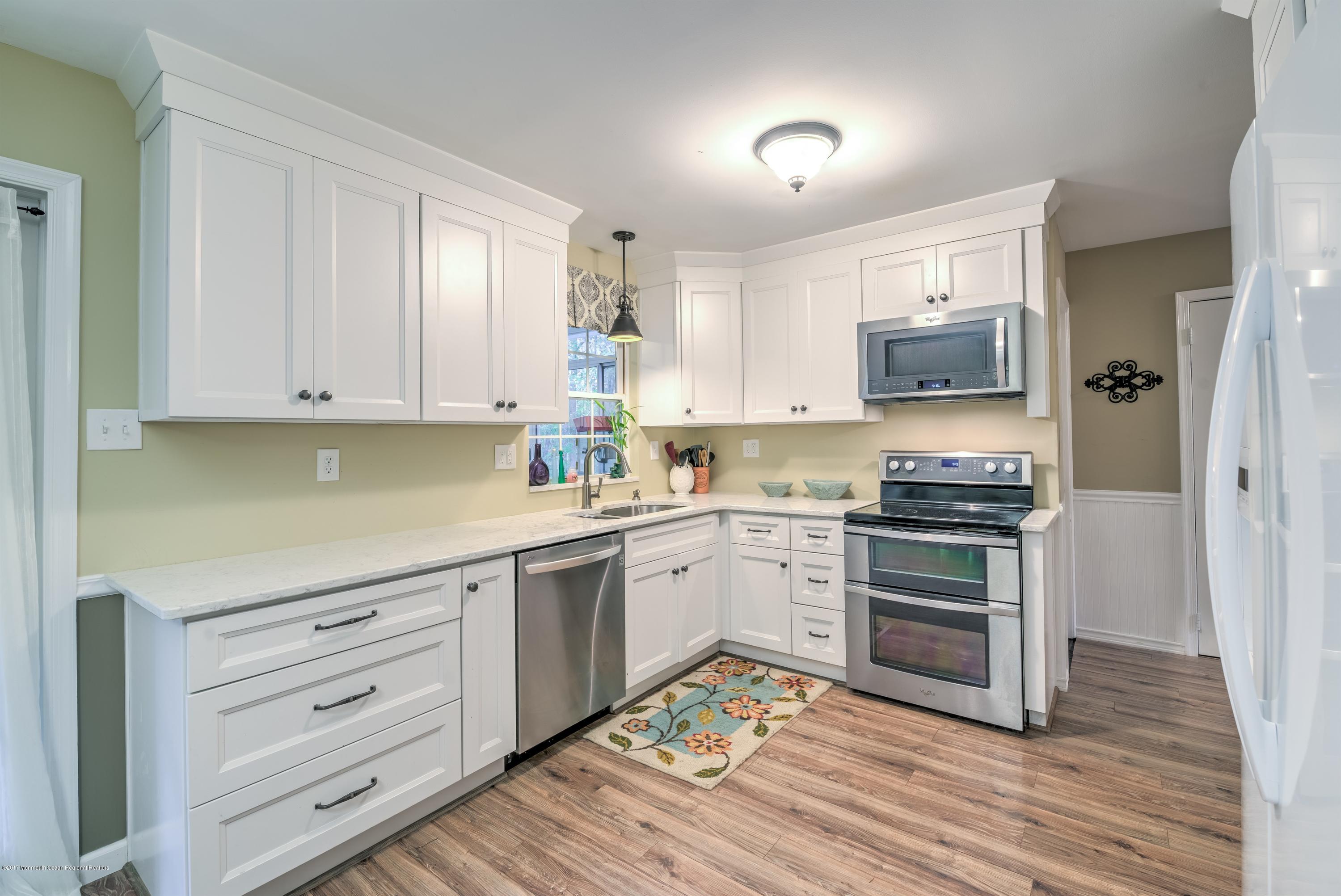 15 Reiner Road Cream Ridge, NJ 08514 - Photo 10 of 27 a kitchen with granite countertop white cabinets and stainless steel appliances