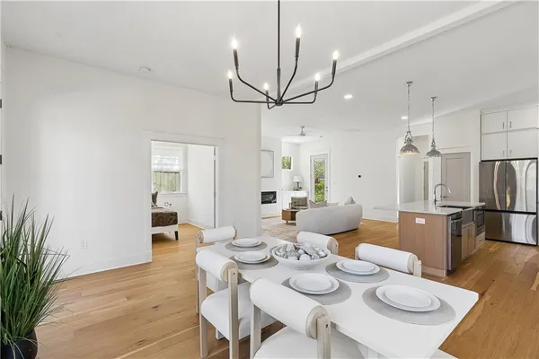 a view of a dining room with furniture and wooden floor