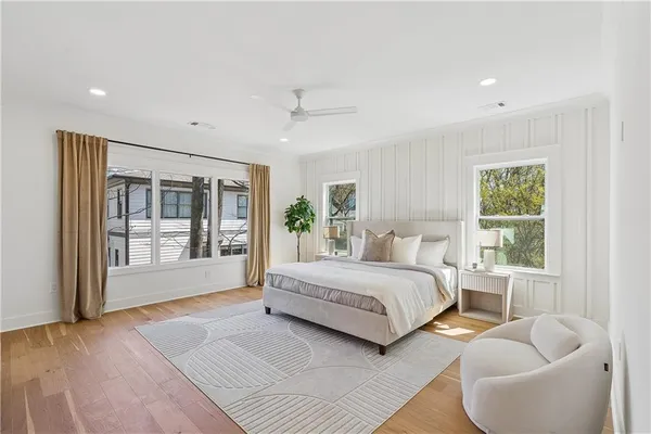 a spacious bedroom with a large bed and a couch