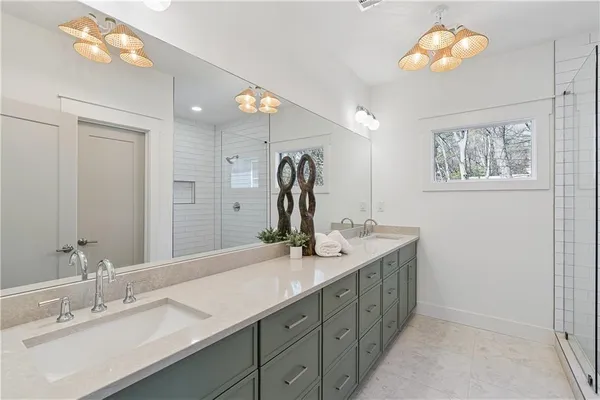 a bathroom with a double vanity sink and a mirror
