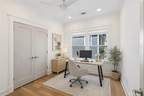 a workspace with furniture and a window