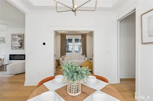 a bedroom with a large bed and a view of living room