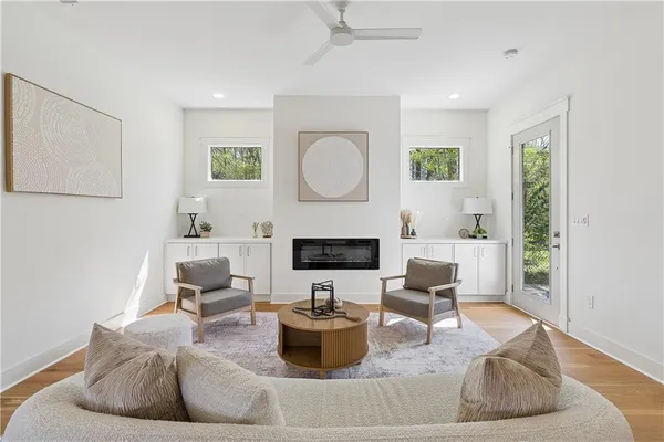 a living room with furniture and a fireplace