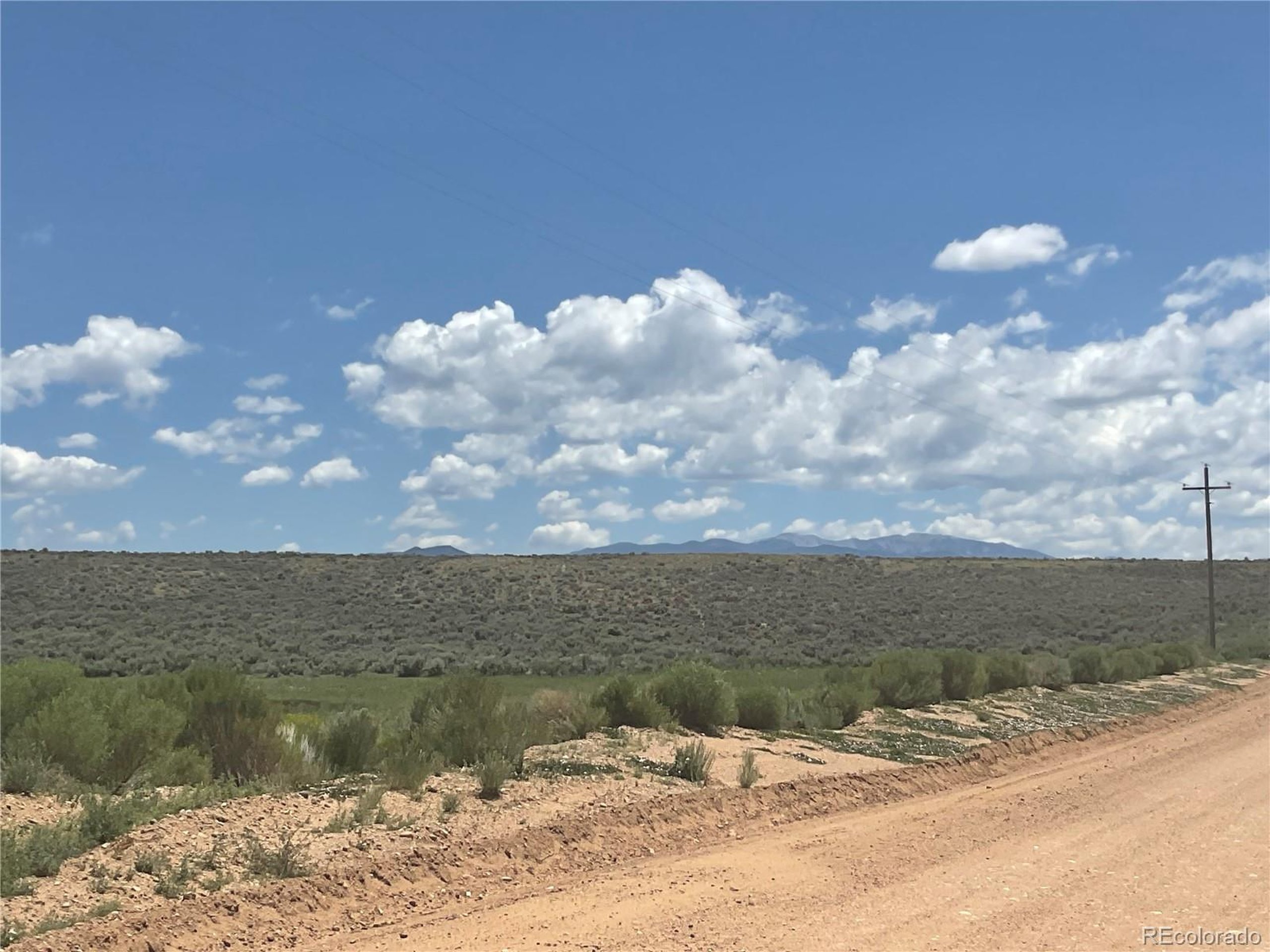 10 County Road North San Luis, CO 81152 - Photo 8 of 11 a view of a lake from a yard
