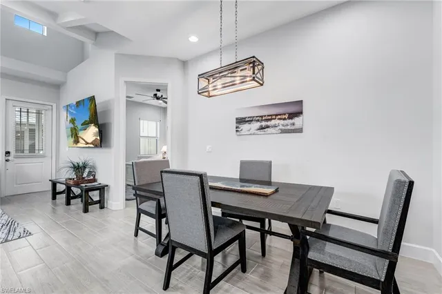 a kitchen with a center island a counter space stainless steel appliances and cabinets