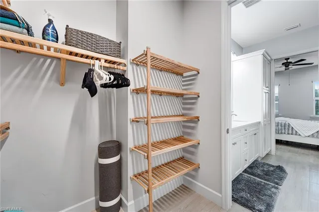a bathroom with a sink vanity and a mirror