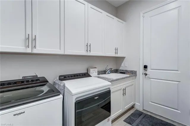 a bedroom with a bed and a television