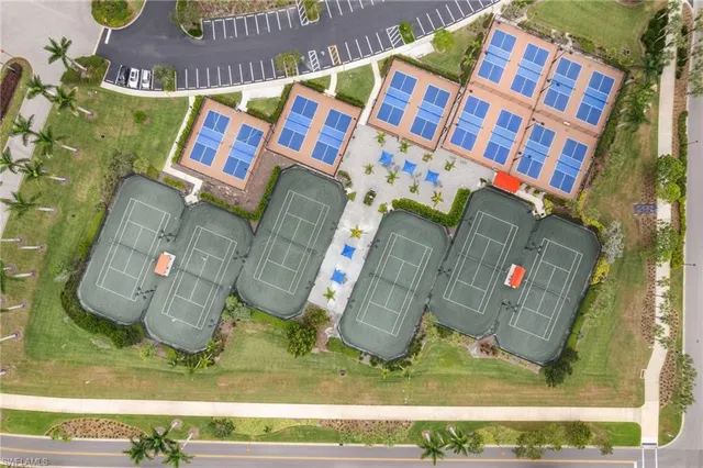 an aerial view of a house with swimming pool and lake view