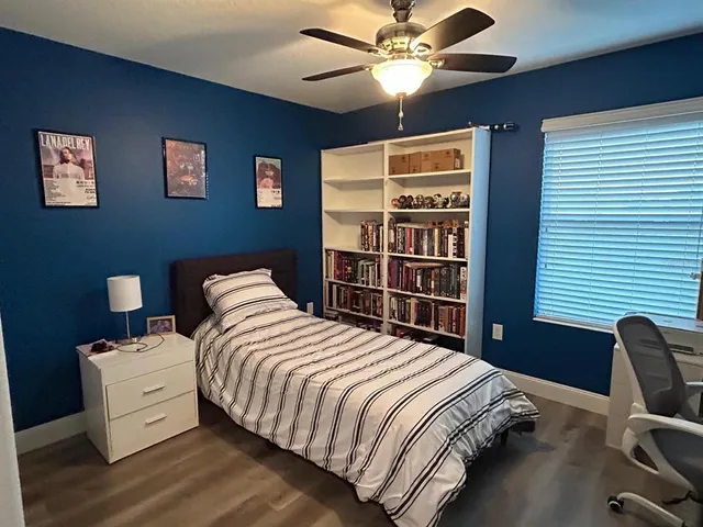 a bedroom with a bed and dresser
