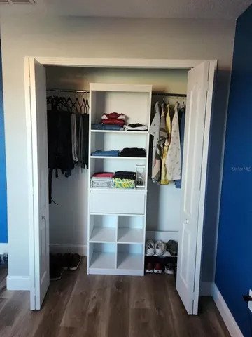 a room with walk in closet and a closet