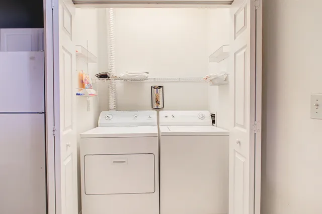 a utility room with dryer and washer