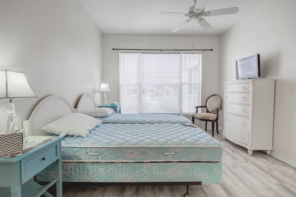 a bedroom with a bed and a table