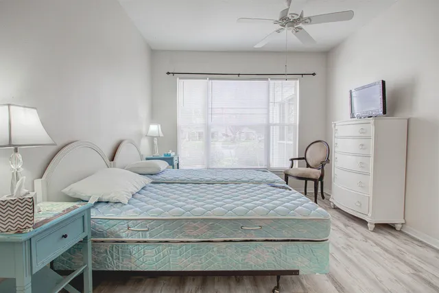 a bedroom with a bed and a table