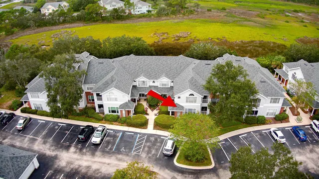 an aerial view of houses with outdoor space swimming pool and lake view