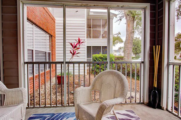 a living room filled with furniture and a window