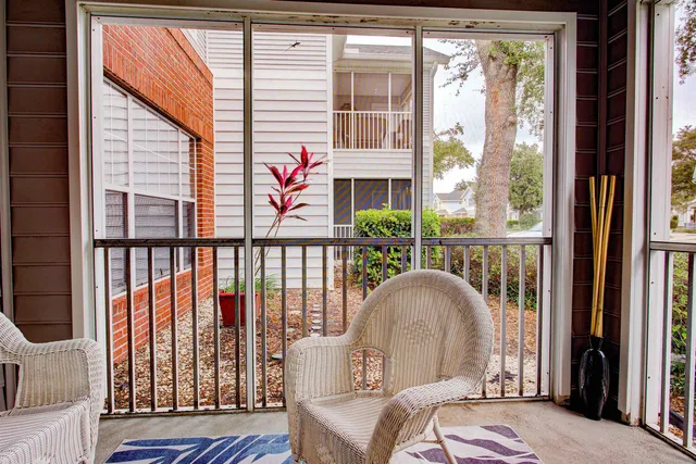 a living room filled with furniture and a window