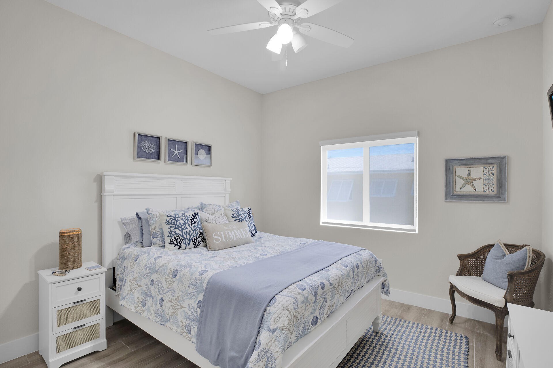 162 Marina Avenue Key Largo, FL 33037 - Photo 33 of 53 a bedroom with a large bed and a chair