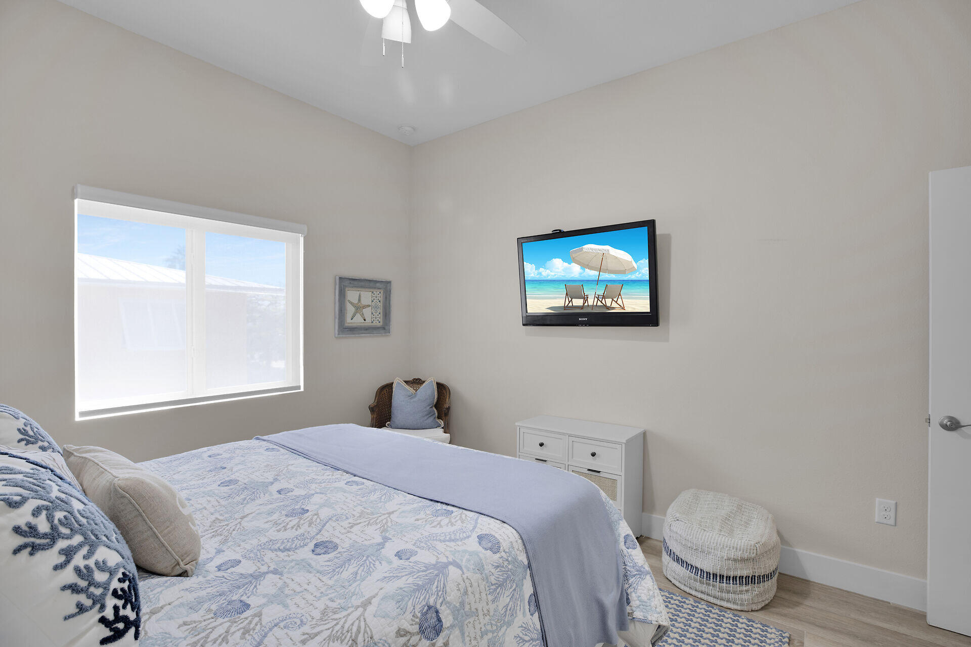 162 Marina Avenue Key Largo, FL 33037 - Photo 34 of 53 a bedroom with a bed and a painting on the wall