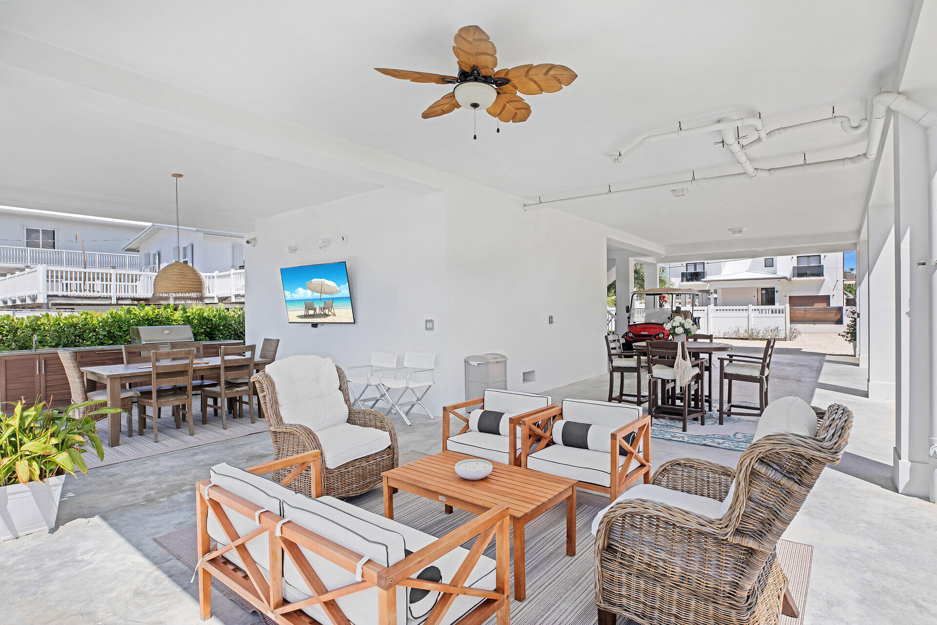 162 Marina Avenue Key Largo, FL 33037 - Photo 39 of 53 a living room with lots of furniture and a chandelier