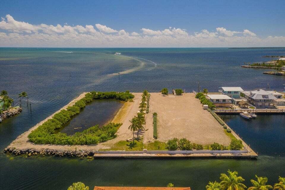 162 Marina Avenue Key Largo, FL 33037 - Photo 47 of 53 an aerial view of a house with a lake view