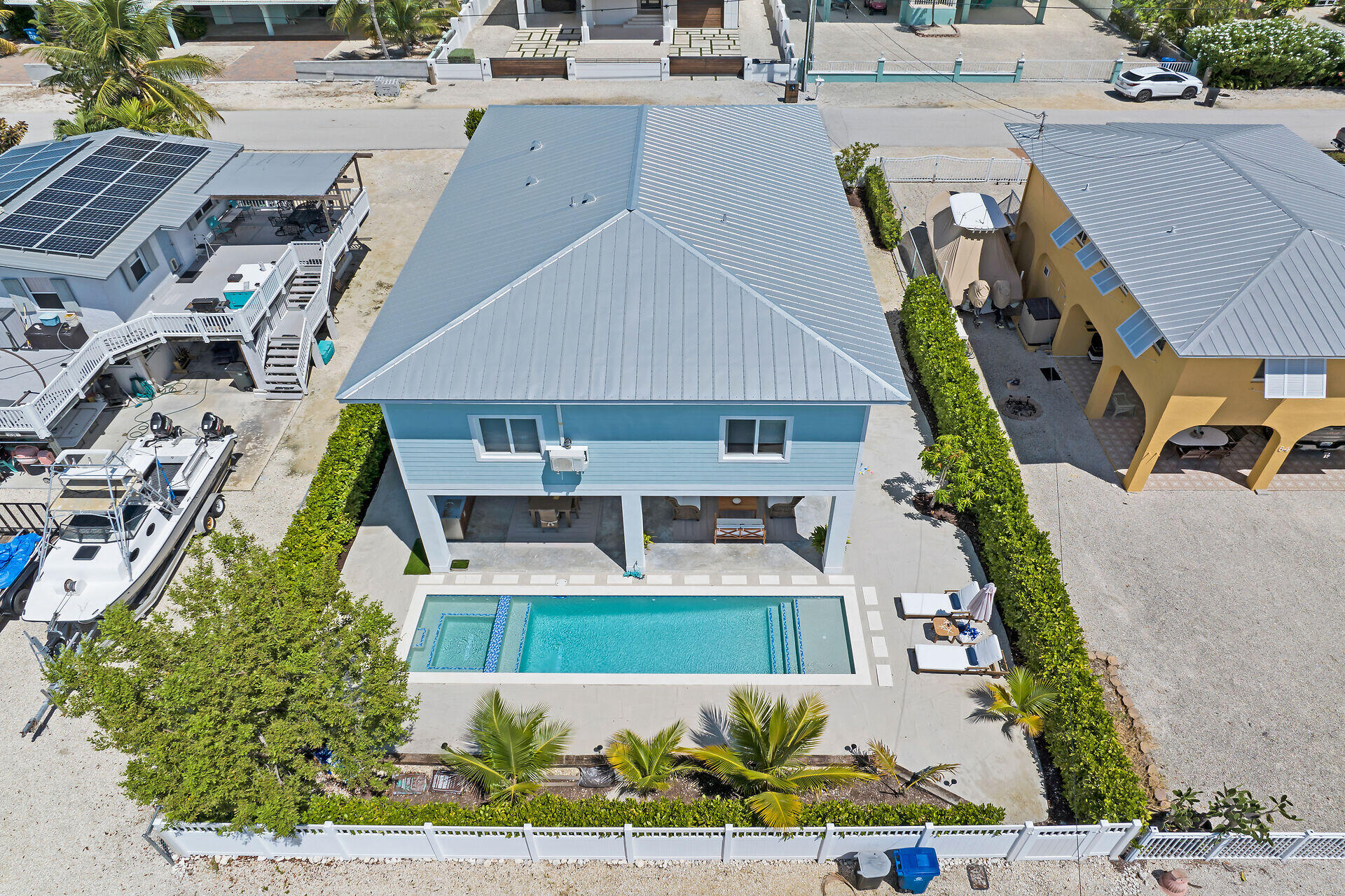 162 Marina Avenue Key Largo, FL 33037 - Photo 8 of 53 an aerial view of a house with a yard and potted plants