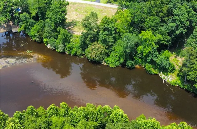 a view of a lake with a yard