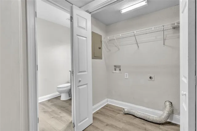 a bathroom with a granite countertop shower and a toilet